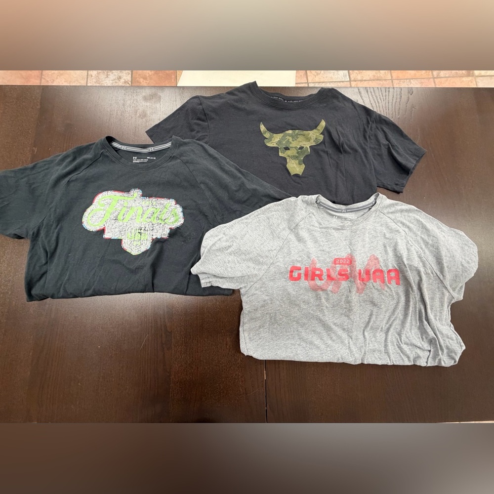 Three size medium Under Armour women’s tee shirts
